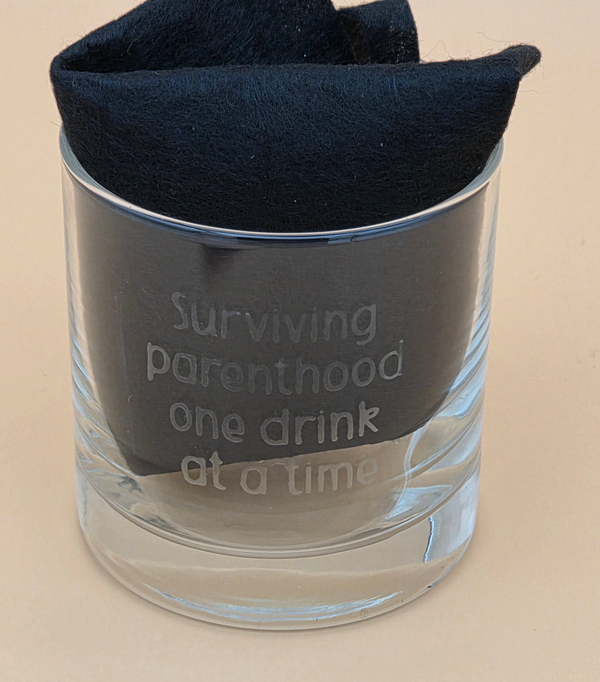 Surviving Parenthood Etched Rocks Glass